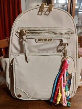 Cream Mini Backpack with Colorful Tassel Charm